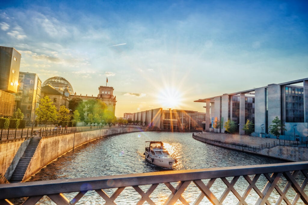 berlin governements district with Reichstag in evening sun over river
