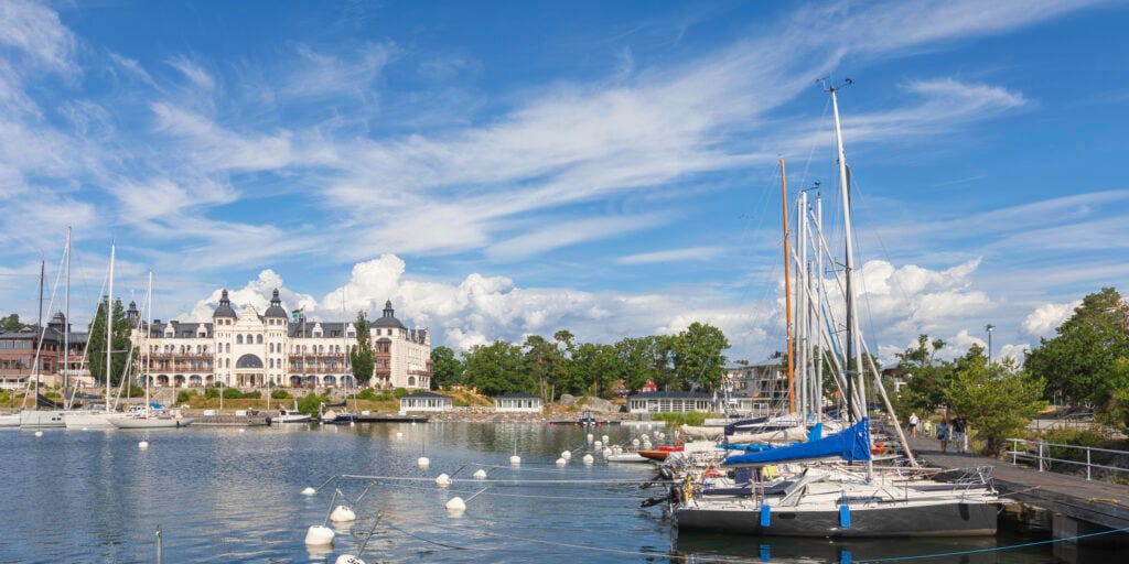Summer in Saltsjöbaden on the Baltic Sea coast in Nacka municipality outside Stockholm, Sweden. In the background is Grand Hotel Saltsjöbaden, opened in 1893.